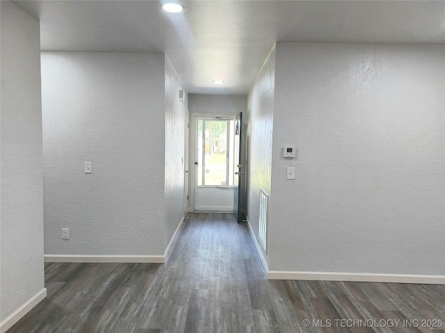 12623 E 19th St, Tulsa, OK 74128 - hall featuring a textured wall, dark wood-style floors, and recessed lighting