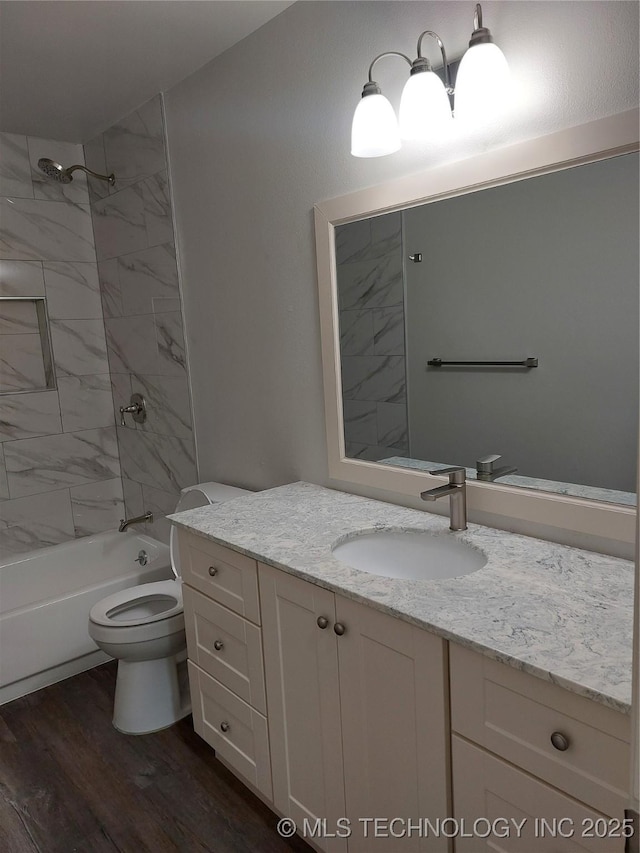 12623 E 19th St, Tulsa, OK 74128 - full bathroom with vanity, wood finished floors, and shower / tub combination