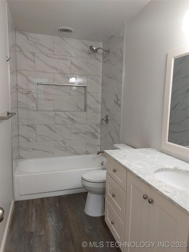 12623 E 19th St, Tulsa, OK 74128 - bathroom featuring vanity, wood finished floors, and shower / bath combination