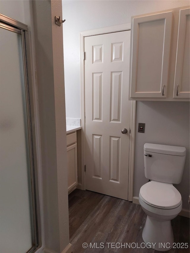 12623 E 19th St, Tulsa, OK 74128 - bathroom with wood finished floors, vanity, and a shower stall
