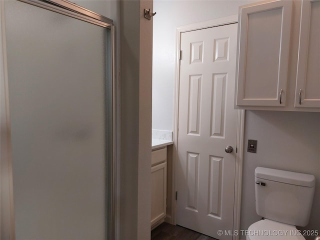 12623 E 19th St, Tulsa, OK 74128 - bathroom featuring a shower stall, vanity, and wood finished floors