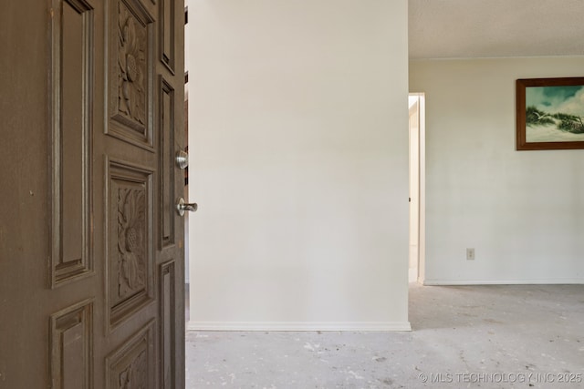 905 W Andrew Ave, Sapulpa, OK 74066 - corridor with unfinished concrete flooring and baseboards