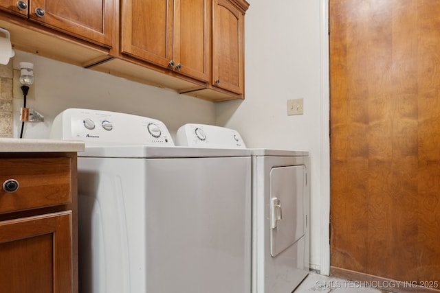 905 W Andrew Ave, Sapulpa, OK 74066 - washroom with washer and clothes dryer and cabinet space