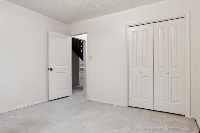 905 W Andrew Ave, Sapulpa, OK 74066 - unfurnished bedroom featuring a closet and a textured ceiling
