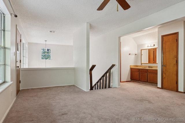 905 W Andrew Ave, Sapulpa, OK 74066 - unfurnished room with a textured ceiling, light carpet, and a ceiling fan