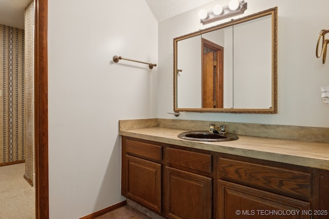 905 W Andrew Ave, Sapulpa, OK 74066 - bathroom featuring vanity and a textured ceiling