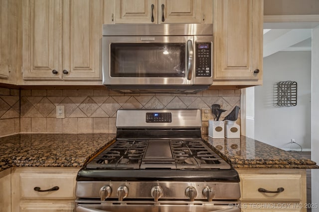 11902 N 150th E Ave, Collinsville, OK 74021 - kitchen with stainless steel appliances, decorative backsplash, light brown cabinets, and dark stone countertops