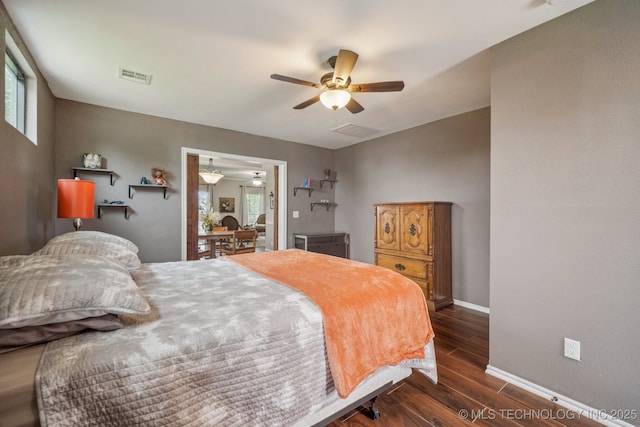 11902 N 150th E Ave, Collinsville, OK 74021 - bedroom with dark wood-style flooring and a ceiling fan