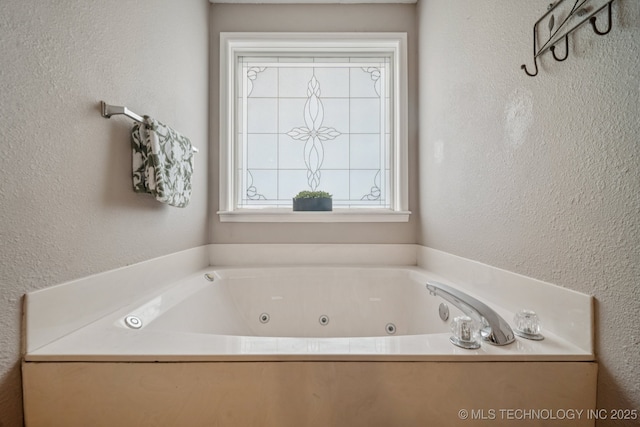 11902 N 150th E Ave, Collinsville, OK 74021 - full bathroom with a whirlpool tub and a textured wall