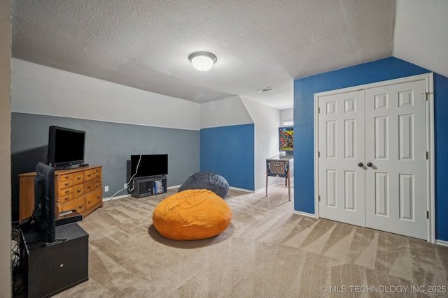 11902 N 150th E Ave, Collinsville, OK 74021 - living area with lofted ceiling, carpet flooring, and a textured ceiling