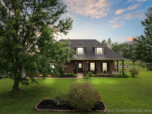 11902 N 150th E Ave, Collinsville, OK 74021 - view of front of house with a chimney, a yard, brick siding, and roof with shingles