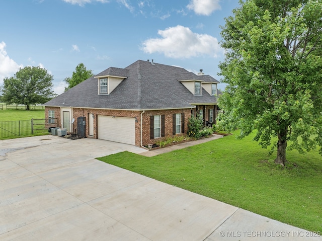 11902 N 150th E Ave, Collinsville, OK 74021 - view of front of house featuring brick siding, driveway, a garage, and a shingled roof