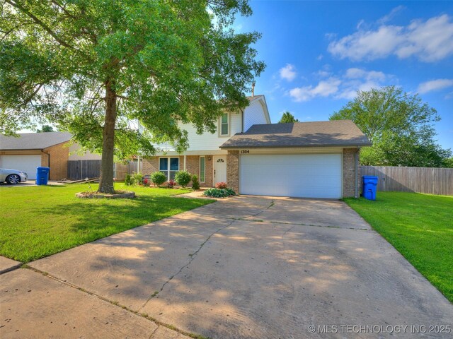 1304 W Kent St, Broken Arrow, OK 74012 - traditional-style home with brick siding, concrete driveway, and a garage
