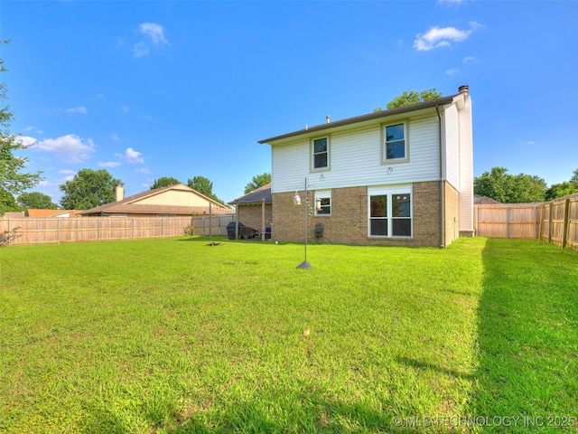 1304 W Kent St, Broken Arrow, OK 74012 - rear view of property with a fenced backyard, a chimney, and brick siding