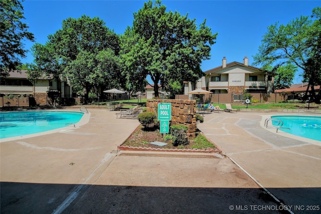6370 S 80th E Ave Unit E, Tulsa, OK 74133 - community pool featuring a patio area