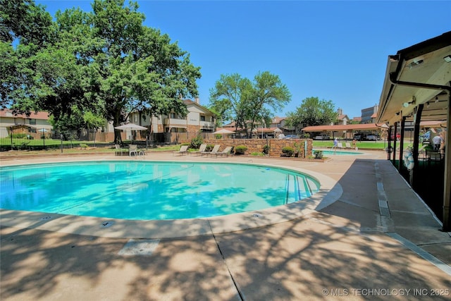 6370 S 80th E Ave Unit E, Tulsa, OK 74133 - community pool with a patio area and a residential view