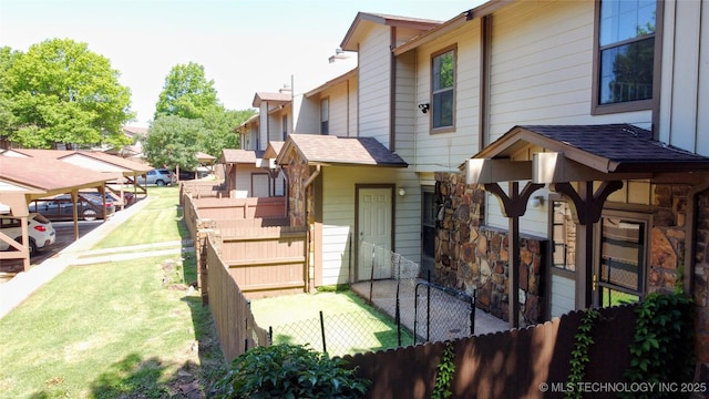 6370 S 80th E Ave Unit E, Tulsa, OK 74133 - view of side of property with a shingled roof