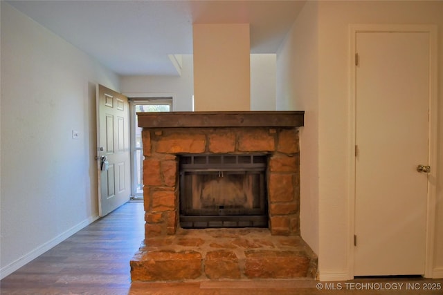 6370 S 80th E Ave Unit E, Tulsa, OK 74133 - detailed view of a stone fireplace and wood finished floors