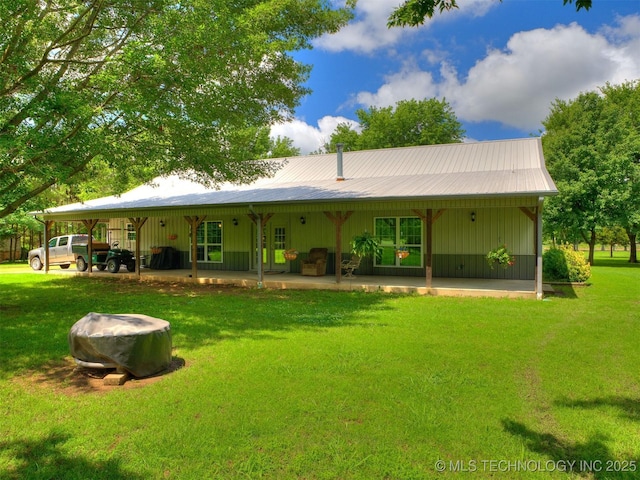 30833 S 4190th Rd, Inola, OK 74006 - rear view of property featuring a lawn and a patio