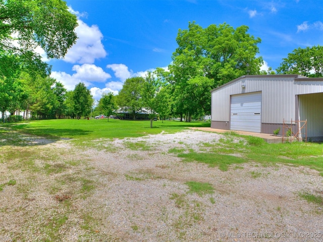 30833 S 4190th Rd, Inola, OK 74006 - view of green lawn with an outbuilding, a garage, and driveway