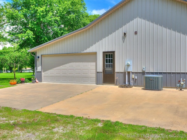 30833 S 4190th Rd, Inola, OK 74006 - view of property exterior with a cooling unit and a detached garage