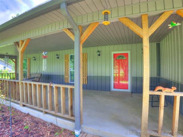 30833 S 4190th Rd, Inola, OK 74006 - doorway to property featuring covered porch and board and batten siding