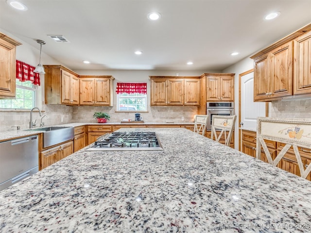 30833 S 4190th Rd, Inola, OK 74006 - kitchen featuring stainless steel appliances, recessed lighting, light stone counters, tasteful backsplash, and pendant lighting