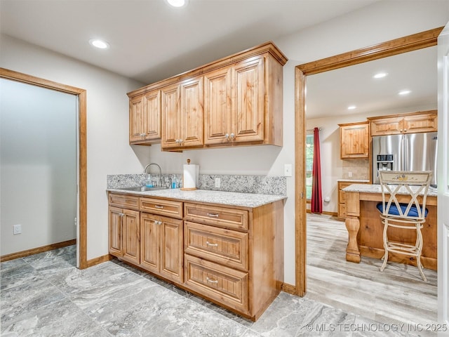 30833 S 4190th Rd, Inola, OK 74006 - kitchen with stainless steel fridge, recessed lighting, and light stone counters
