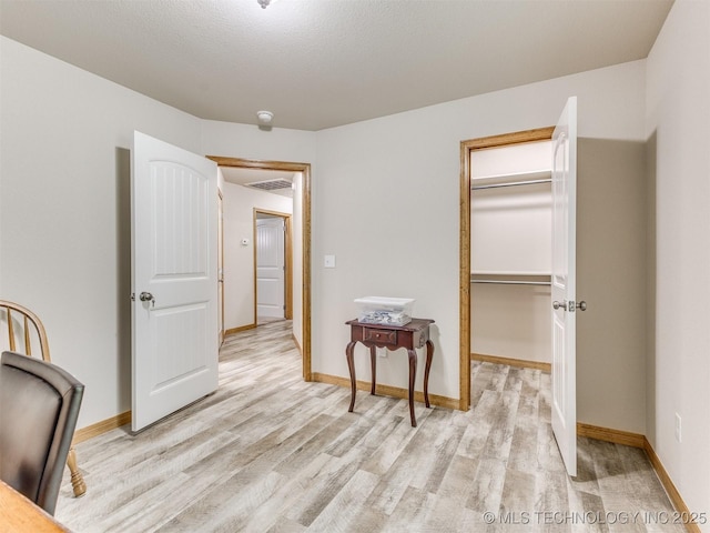 30833 S 4190th Rd, Inola, OK 74006 - bedroom with light wood-style floors, a spacious closet, and a closet