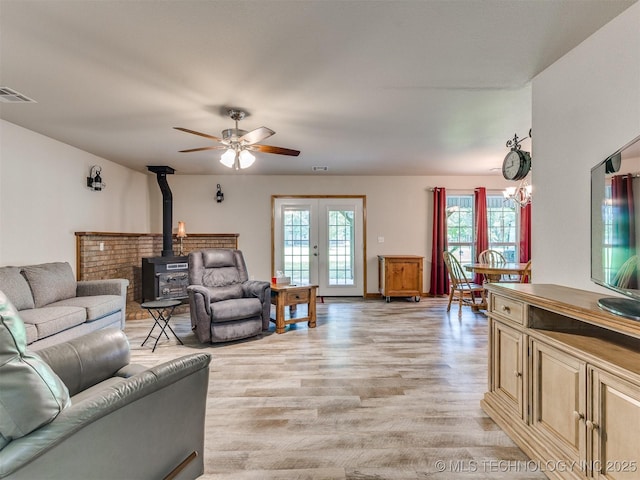 30833 S 4190th Rd, Inola, OK 74006 - living area with a wood stove, light wood-type flooring, and ceiling fan