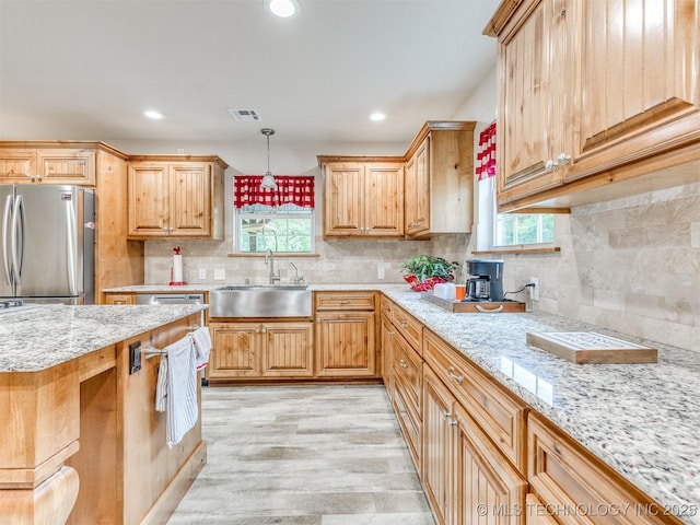 30833 S 4190th Rd, Inola, OK 74006 - kitchen with freestanding refrigerator, healthy amount of natural light, light wood-style floors, light stone counters, and recessed lighting