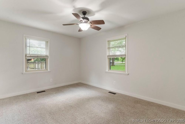 17069 S 87th Ave E, Bixby, OK 74008 - empty room featuring healthy amount of natural light, carpet flooring, and a ceiling fan