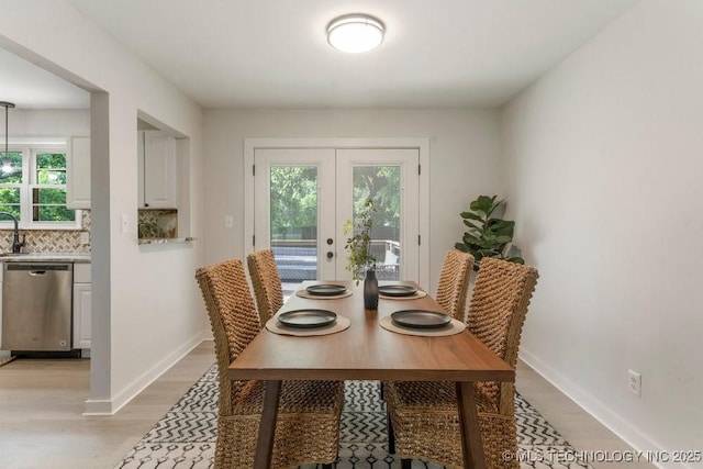 17069 S 87th Ave E, Bixby, OK 74008 - dining space with french doors and light wood-style floors