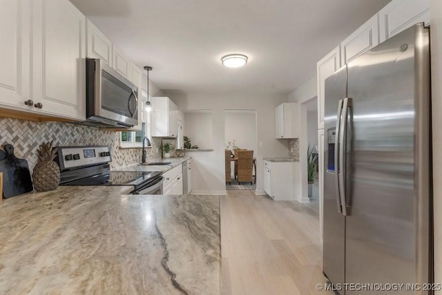17069 S 87th Ave E, Bixby, OK 74008 - kitchen featuring stainless steel appliances, tasteful backsplash, and white cabinetry