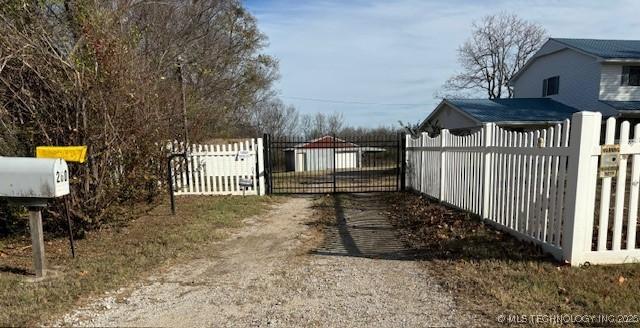 260 N 260th Rd, Mounds, OK 74047 - view of road with a gate and a gated entry