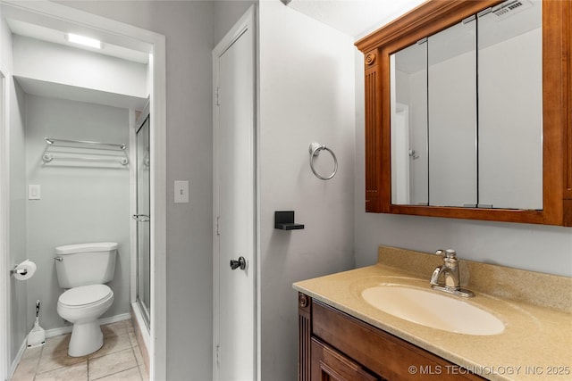 6364 S 80th E Ave Unit 34E, Tulsa, OK 74133 - bathroom with vanity, a shower stall, and tile patterned floors