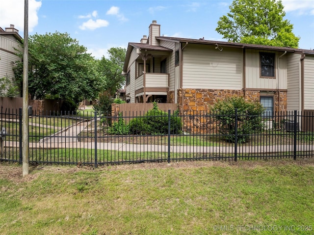 6364 S 80th E Ave Unit 34E, Tulsa, OK 74133 - view of side of home with a chimney and stone siding