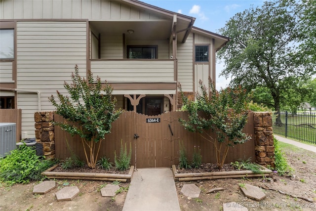 6364 S 80th E Ave Unit 34E, Tulsa, OK 74133 - view of property exterior featuring a balcony and a central air condition unit