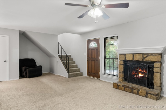 6364 S 80th E Ave Unit 34E, Tulsa, OK 74133 - entryway with stairs, carpet flooring, ceiling fan, and a fireplace