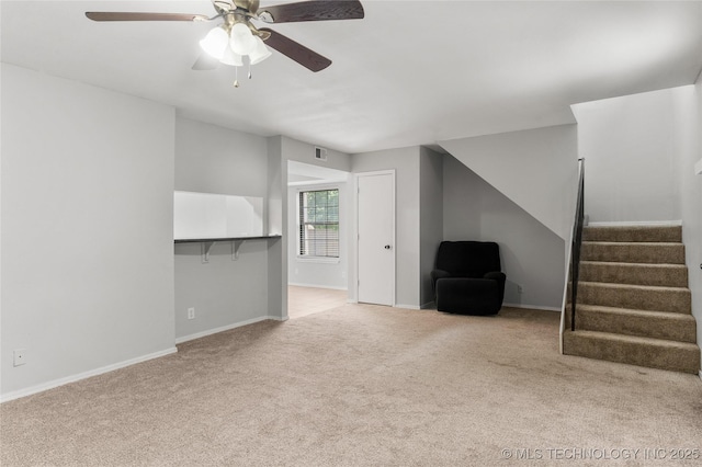 6364 S 80th E Ave Unit 34E, Tulsa, OK 74133 - unfurnished living room with stairway, carpet flooring, and ceiling fan