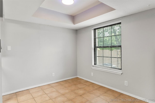 6364 S 80th E Ave Unit 34E, Tulsa, OK 74133 - unfurnished room featuring a raised ceiling and baseboards