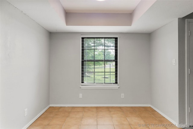 6364 S 80th E Ave Unit 34E, Tulsa, OK 74133 - tiled spare room with healthy amount of natural light and a raised ceiling