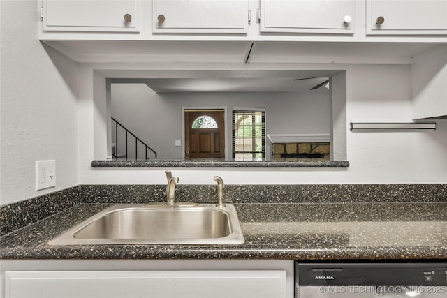 6364 S 80th E Ave Unit 34E, Tulsa, OK 74133 - kitchen with dishwasher, white cabinetry, and dark stone countertops