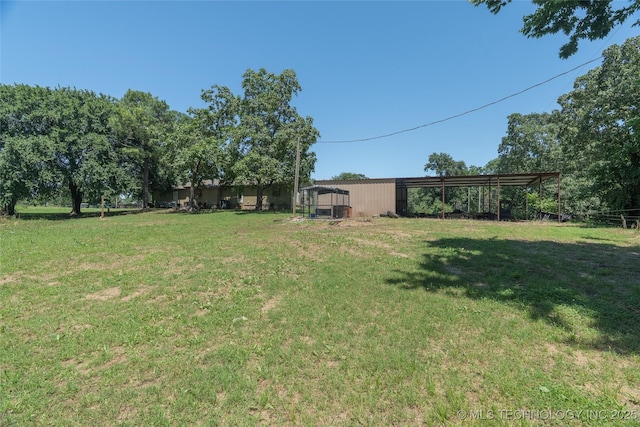 9730 S 4050th Rd, Talala, OK 74080 - view of green lawn featuring a pole building and an outdoor structure