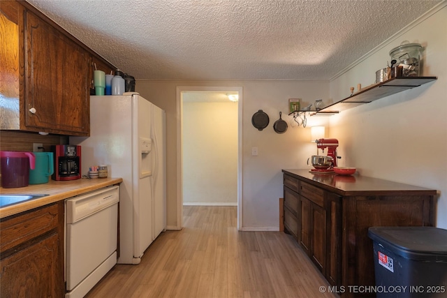9730 S 4050th Rd, Talala, OK 74080 - kitchen featuring white appliances, light wood finished floors, a textured ceiling, and light countertops