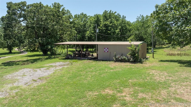 9730 S 4050th Rd, Talala, OK 74080 - view of grassy yard with a pole building, an outdoor structure, and a carport