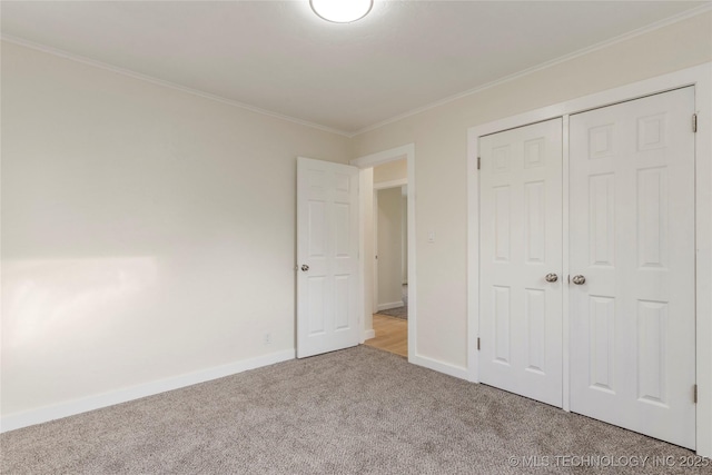 4138 E 36th St, Tulsa, OK 74135 - unfurnished bedroom featuring carpet floors, ornamental molding, and a closet