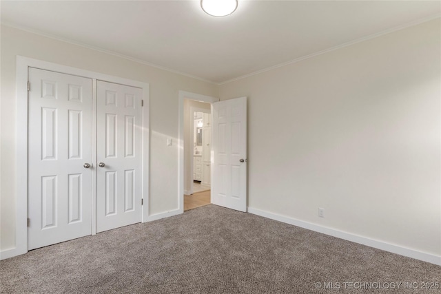 4138 E 36th St, Tulsa, OK 74135 - unfurnished bedroom featuring carpet floors, crown molding, and a closet