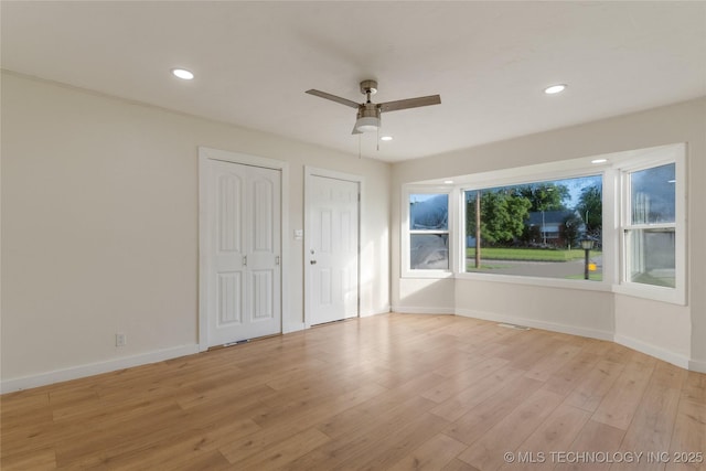 4138 E 36th St, Tulsa, OK 74135 - unfurnished bedroom with multiple closets, light wood-style floors, recessed lighting, and a ceiling fan
