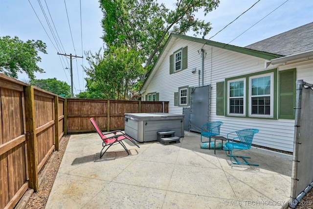 1347 E 37th St, Tulsa, OK 74105 - fenced backyard featuring a hot tub and a patio area